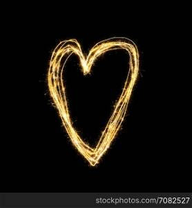 Heart shape from sparkler on black background