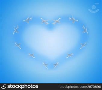Heart shape from the airplanes in the blue sky