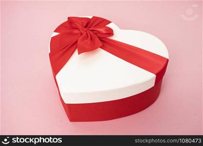 Heart shape gift box on a pink background