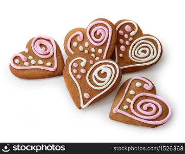 Heart shape ginger breads decorated with pink and white sugar glazi. Heart shape ginger breads
