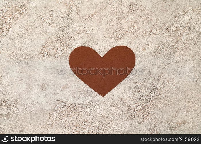 Heart shape made of coffee or cocoa powder on concrete background.. Heart shape made of coffee or cocoa powder on concrete background