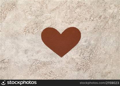 Heart shape made of coffee or cocoa powder on concrete background.. Heart shape made of coffee or cocoa powder on concrete background