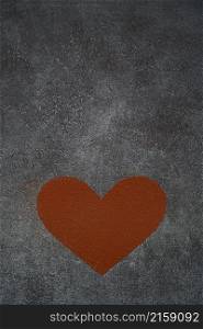 Heart shape made of grinded coffee or cocoa powder on concrete background.. Heart shape made of grinded coffee or cocoa powder on concrete background