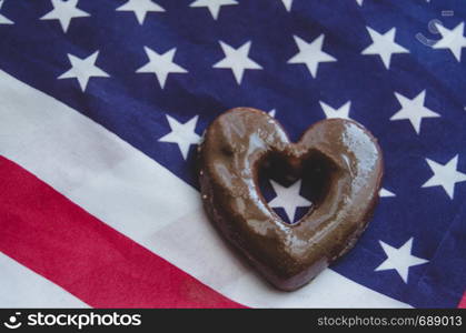 heart shaped biscuits and usa flag on wooden table - happy memorial day.. heart shaped biscuits and usa flag on wooden table happy memorial day.