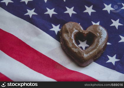 heart shaped biscuits and usa flag on wooden table - happy memorial day.. heart shaped biscuits and usa flag on wooden table happy memorial day.