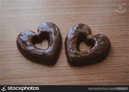 Heart Shaped biscuits on wooden table love and sharing concept. Heart Shaped biscuits on wooden table