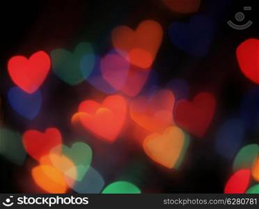 Heart shaped blurred lights. Colorful blurred bokeh lights