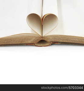 Heart shaped book pages on white background