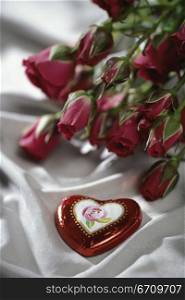 Heart-shaped candy with red roses