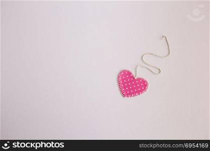 Heart-shaped cloth patch on white background.