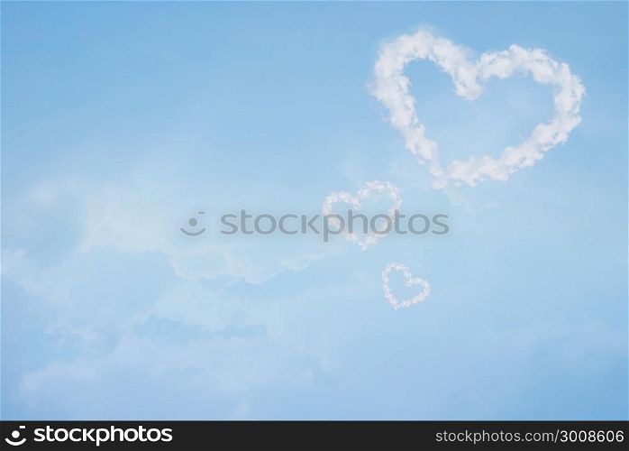 Heart shaped cloud in blue sky. Valentine and wedding background.