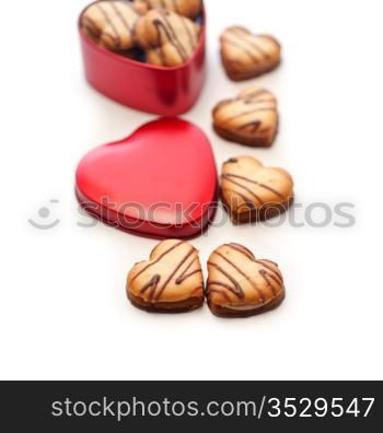 heart shaped cream cookies on red heart metal box