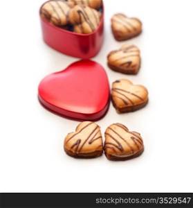 heart shaped cream cookies on red heart metal box