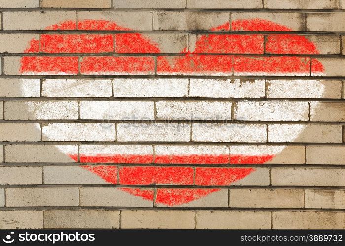 heart shaped flag in colors of Austria on brick wall