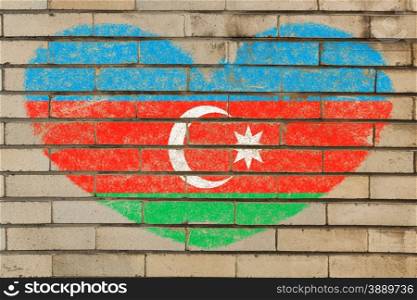 heart shaped flag in colors of azerbaijan on brick wall