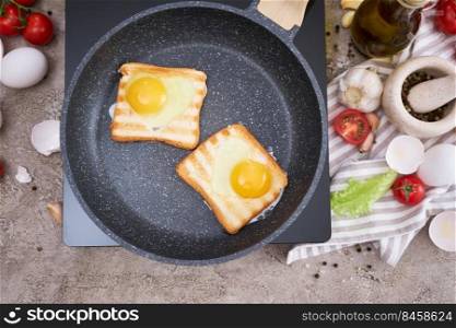 Heart shaped Fried Egg on Toast Bread in a pan at domestic kitchen.. Heart shaped Fried Egg on Toast Bread in a pan at domestic kitchen