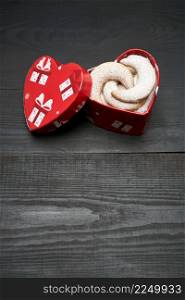 Heart shaped Gift box full of Traditional German or Austrian Vanillekipferl vanilla kipferl cookies. High quality photo. Heart shaped Gift box full of Traditional German or Austrian Vanillekipferl vanilla kipferl cookies