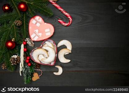 Heart shaped Gift box full of Traditional German or Austrian Vanillekipferl vanilla kipferl cookies. High quality photo. Heart shaped Gift box full of Traditional German or Austrian Vanillekipferl vanilla kipferl cookies