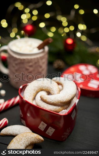 Heart shaped Gift box full of Traditional German or Austrian Vanillekipferl vanilla kipferl cookies. High quality photo. Heart shaped Gift box full of Traditional German or Austrian Vanillekipferl vanilla kipferl cookies