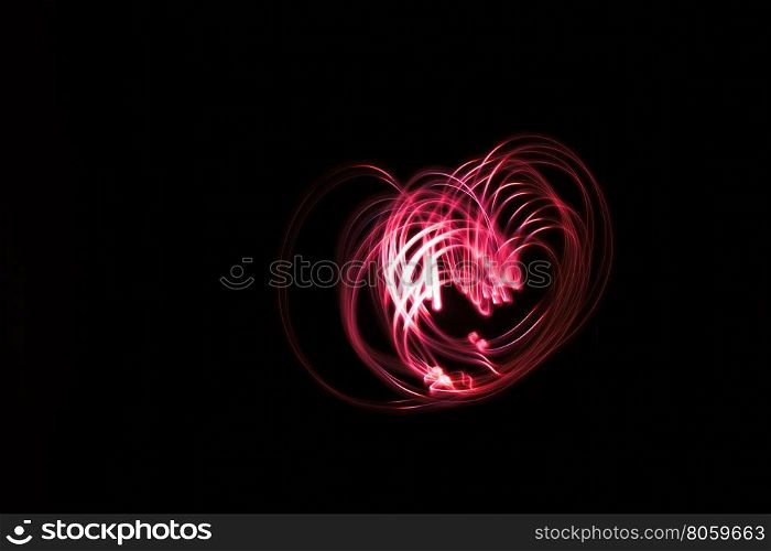 Heart shaped glowing abstract curved lines.