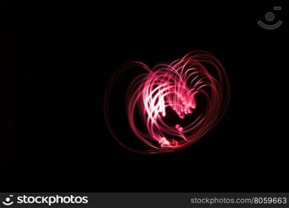 Heart shaped glowing abstract curved lines.