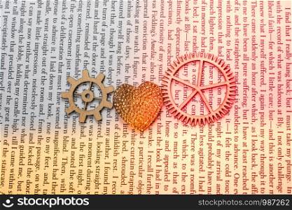 Heart shaped icon andWooden cogwheels as love concepts