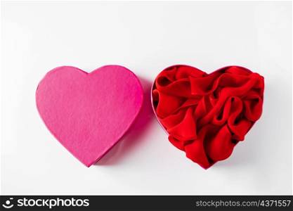 Heart shaped open gift box on white background. Concept for Valentine&rsquo;s Day. Open empty pink heart shaped gift box on a white background.. Heart shaped open gift box on white background.