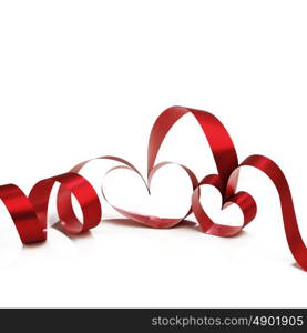Heart shaped red ribbon isolated on white background