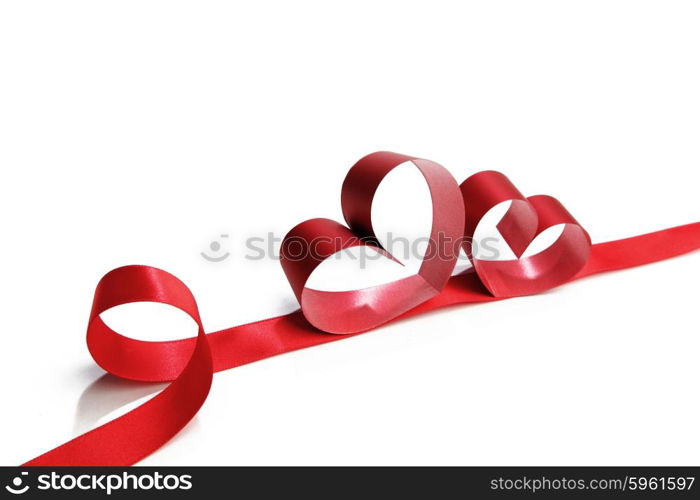 Heart shaped red ribbon isolated on white background