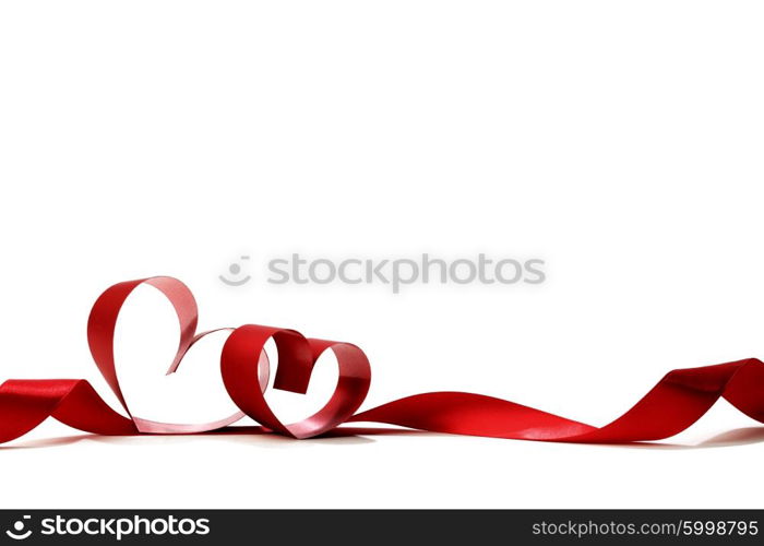 Heart shaped red ribbon isolated on white background