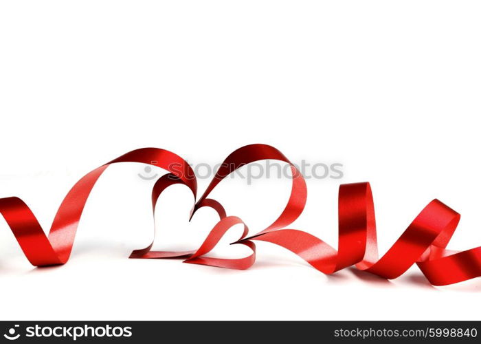 Heart shaped red ribbon isolated on white background