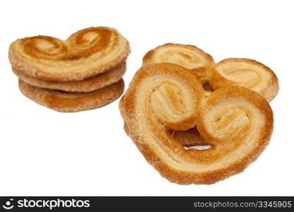 Heart shaped saporelly, sweet puff pastry, isolated over a white background.