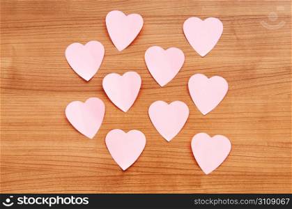 Heart shaped sticky notes on the background