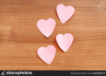 Heart shaped sticky notes on the background