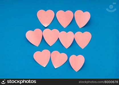 Heart shaped sticky notes on the background