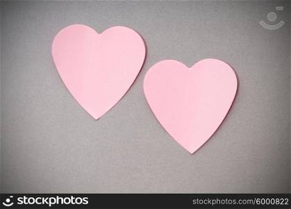 Heart shaped sticky notes on the background