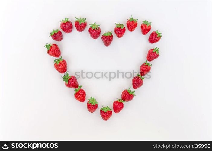 Heart shaped strawberries on white background, strawberry heart, isolated