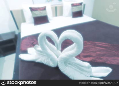 Heart-shaped towels on the bed, Valentine&rsquo;s Day concept, vintage filter image