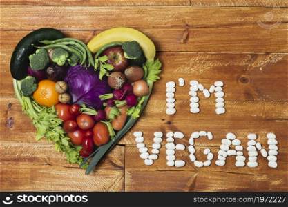 heart shaped vegetable arrangement wooden background. High resolution photo. heart shaped vegetable arrangement wooden background. High quality photo