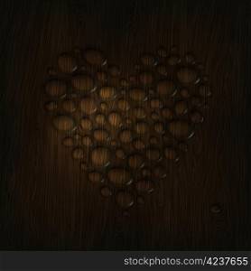 Heart shaped water drops on a wooden texture.
