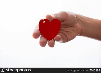 Heart shaped white object in hand on white background