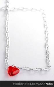 Heart with a chain made in the form of a frame leaving in a distance