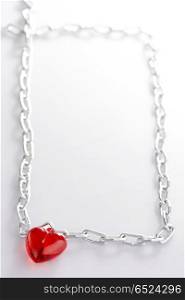 Heart with a chain made in the form of a frame leaving in a distance. Chain of love