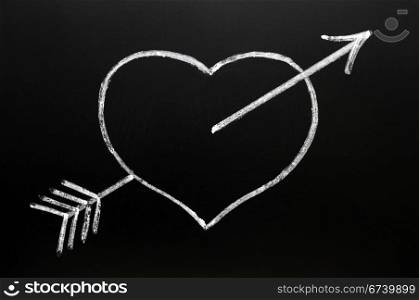 Heart with Cupid&rsquo;s arrow hitting through, drawn in chalk