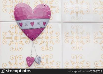 Heart with two large ceramic ceramic hearts on the wall
