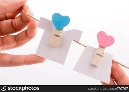 Hearted clothespins hanging on a thin rope