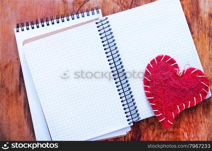 hearts and note on the wooden table