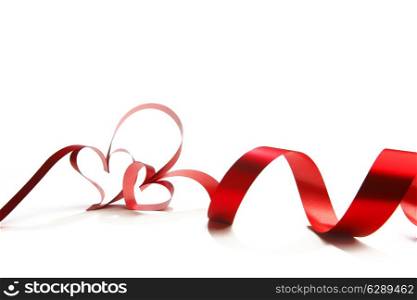 Hearts from red ribbon isolated on white background
