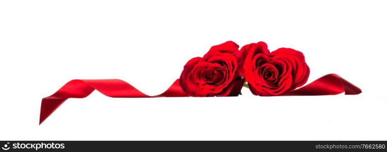 Hearts of red roses and curly ribbons isolated on white background Valentines day design. Hearts of res roses