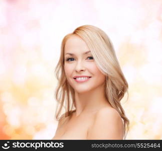 heath and beauty concept - closeup of clean face and shoulders of beautiful young woman